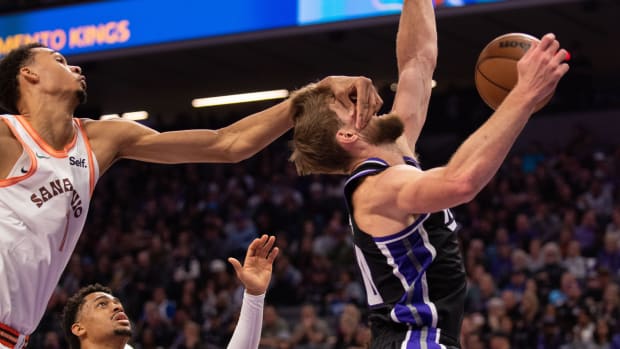 Sacramento Kings forward Domantas Sabonis (10) is fouled by San Antonio Spurs center Victor Wembanyama (1) during the second quarter at Golden 1 Center.