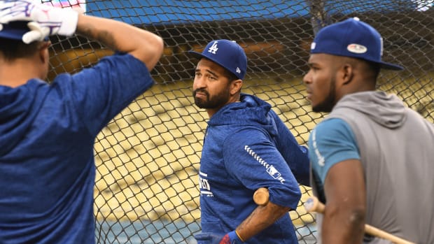Oct 3, 2018; Los Angeles, CA, USA; Los Angeles Dodgers infielder Manny Machado (left), outfielder Matt Kemp (center) and outfielder Yasiel Puig stretch before taking batting practice prior to game one of the 2018 NLDS playoff baseball series at Dodgers Stadium.