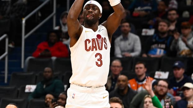 Feb 7, 2024; Washington, District of Columbia, USA; Cleveland Cavaliers guard Caris LeVert (3) shoots a three point shot /away from/ during the first half at Capital One Arena.