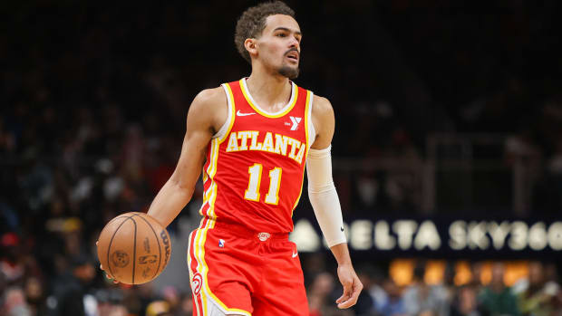 Hawks guard Trae Young handles the ball against the Houston Rockets.