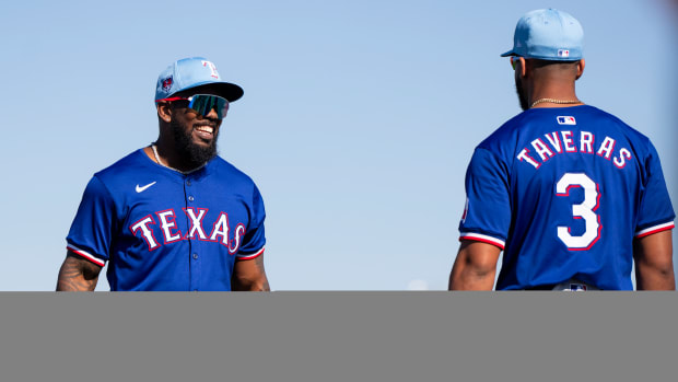 Bruce Bochy said he's purposely "slow-playing" Texas Rangers outfielder Adolis García, left, and catcher Jonah Heim early in the spring training schedule