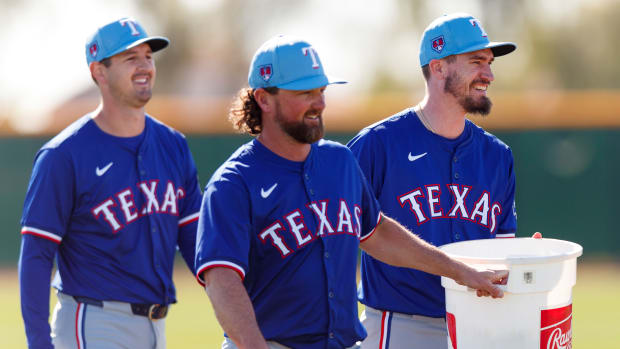 Texas Rangers starter Andrew Heaney, right, struck out five in two innings in his first spring start on Sunday.