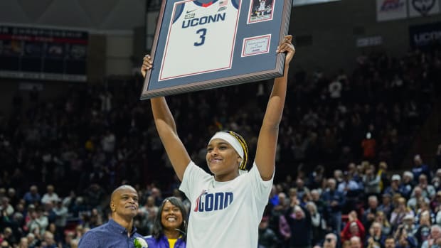 Feb 16, 2024; Storrs, Connecticut, USA; UConn Huskies forward Aaliyah Edwards (3) holds up her jersey during senior night after defeating the Georgetown Hoyas at Harry A. Gampel Pavilion. 
