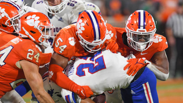 Sep 17, 2022; Clemson, South Carolina, USA; Clemson Tigers safety Tyler Venables (24) and linebacker Jeremiah Trotter Jr. (54) tackle Louisiana Tech Bulldogs running back Charvis Thornton (22) during the fourth quarter at Memorial Stadium.