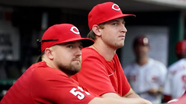 Cincinnati Reds starting pitcher Graham Ashcraft (51), left, and Cincinnati Reds starting pitcher Nick Lodolo (40) watch from the dugout during the fifth inning of a baseball game against the Atlanta Braves, Friday, July 1, 2022, at Great American Ball Park in Cincinnati. The Atlanta Braves won, 9-1. Atlanta Braves At Cincinnati Reds July 1 0032 