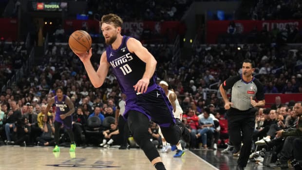 Feb 25, 2024; Los Angeles, California, USA; Sacramento Kings forward Domantas Sabonis (10) dribbles the ball against the LA Clippers in the second half at Crypto.com Arena. Mandatory Credit: Kirby Lee-USA TODAY Sports  
