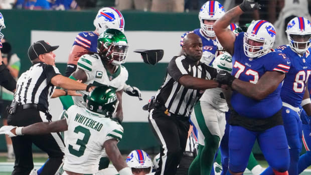 Sep 11, 2023; East Rutherford, New Jersey, USA; New York Jets safety Jordan Whitehead (3) gets pushed down by Buffalo Bills offensive tackle Dion Dawkins (73) in a scuffle following a Jets recovery of a Bills fumble in the second half at MetLife Stadium.