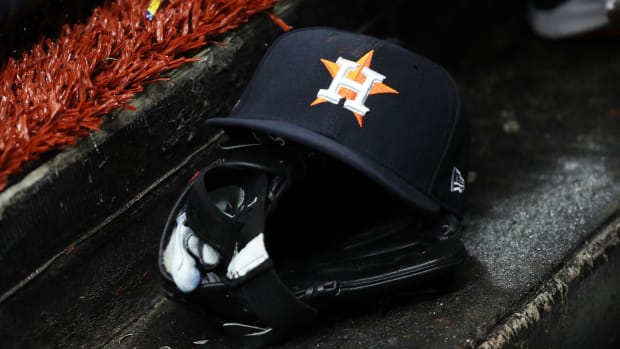 Mar 28, 2019; St. Petersburg, FL, USA; A detail view of a Houston Astros baseball hat and glove lay in the dugout at Tropicana Field. Mandatory Credit: Kim Klement-USA TODAY Sports