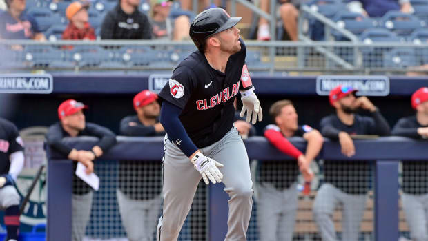 Feb 26, 2024; Peoria, Arizona, USA; Cleveland Guardians catcher David Fry (6) hits a two-run home run in the second inning against the San Diego Padres during a spring training game at Peoria Sports Complex.
