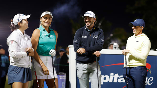 Rose Zhang, Lexi Thompson, Max Homa and Rory McIlroy talk on the fist tee during Capital One's The Match IX at The Park West Palm on February 26, 2024 in West Palm Beach, Florida. 