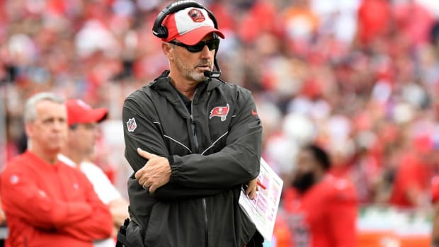 Tampa Bay Buccaneers head coach Dirk Koetter looks on from the sidelines during a game.