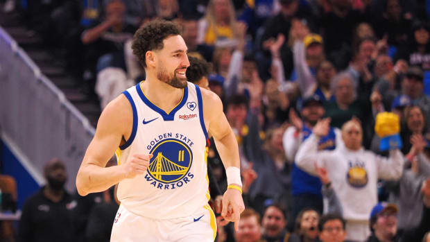 Jan 24, 2024; San Francisco, California, USA; Golden State Warriors guard Klay Thompson (11) smiles after scoring against the Atlanta Hawks during the first quarter at Chase Center.