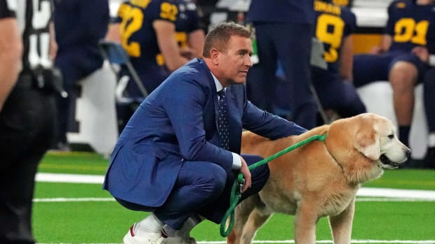 Jan 8, 2024; Houston, TX, USA; ESPN analyst Kirk Herbstreit walks his dog Ben before the 2024 College Football Playoff national championship game between the Michigan Wolverines and the Washington Huskies at NRG Stadium. Mandatory Credit: Kirby Lee-USA TODAY Sports