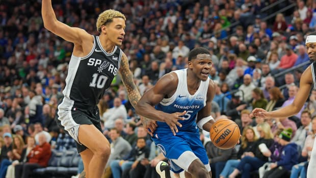 Minnesota Timberwolves guard Anthony Edwards (5) dribbles against the San Antonio Spurs forward Jeremy Sochan (10) in the second quarter at Target Center in Minneapolis on Feb. 27, 2024.