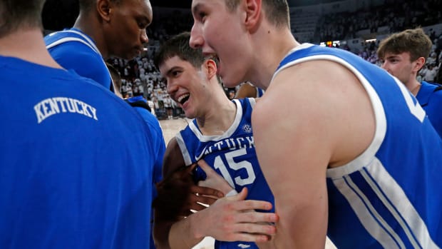 Feb 27, 2024; Starkville, Mississippi, USA; Kentucky Wildcats forward Ugonna Onyenso (33) and forward Zvonimir Ivisic (44) celebrate with guard Reed Sheppard (15) after defeating the Mississippi State Bulldogs at Humphrey Coliseum. Mandatory Credit: Petre Thomas-USA TODAY Sports