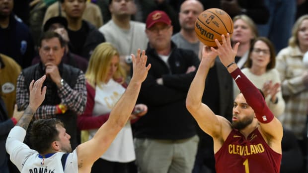 Feb 27, 2024; Cleveland, Ohio, USA; Cleveland Cavaliers guard Max Strus (1) makes a last-second, game-winning three-point basket beside Dallas Mavericks guard Luka Doncic (77) in the fourth quarter against at Rocket Mortgage FieldHouse.