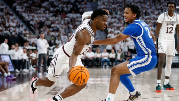 Feb 27, 2024; Starkville, Mississippi, USA; Mississippi State Bulldogs guard Josh Hubbard (13) drives to the basket as Kentucky Wildcats guard D.J. Wagner (21) defends during the first half at Humphrey Coliseum. Mandatory Credit: Petre Thomas-USA TODAY Sports