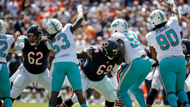 Aug 14, 2021; Chicago, Illinois, USA; Chicago Bears center Adam Redmond (left) and offensive guard Dareuan Parker (69) block against the Miami Dolphins during the second half at Soldier Field. Mandatory Credit: Jon Durr-USA TODAY Sports  