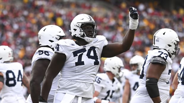 Nov 4, 2023; College Park, Maryland, USA; Penn State Nittany Lions offensive lineman Olumuyiwa Fashanu (74) celebrates after a first-half touchdown against the Maryland Terrapins at SECU Stadium.