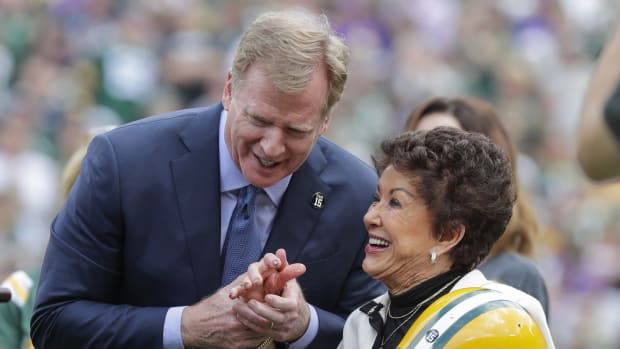 NFL Commissioner Roger Goodell presents a Green Bay Packers helmet to Cherry Starr at a halftime ceremony honoring her late husband Bart Starr Sunday, September 15, 2019, at Lambeau Field in Green Bay, Wis. Gpg Packers Vs Vikings 091519 Jc2145  