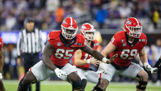 Jan 9, 2023; Inglewood, CA, USA; Georgia Bulldogs offensive lineman Amarius Mims (65) and offensive lineman Tate Ratledge (69) against the TCU Horned Frogs during the CFP national championship game at SoFi Stadium.