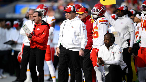 Jan 7, 2024; Inglewood, California, USA; Kansas City Chiefs defensive line coach Joe Cullen (center) looks on from the sideline alongside defensive coordinator Steve Spagnuolo (left) and defensive backs coach Dave Merritt (bottom, right) during the first half against the Los Angeles Chargers at SoFi Stadium. Mandatory Credit: Orlando Ramirez-USA TODAY Sports