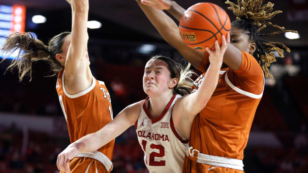 Oklahoma Sooners guard Payton Verhulst (12) puts up a shot between Texas Longhorns guard Shay Holle, left, and Texas Longhorns forward DeYona Gaston (5) during a women's college basketball game between the University of Oklahoma Sooners (OU) and the Texas Longhorns at Lloyd Noble Center in Norman, Okla., Wednesday, Feb. 28, 2024.