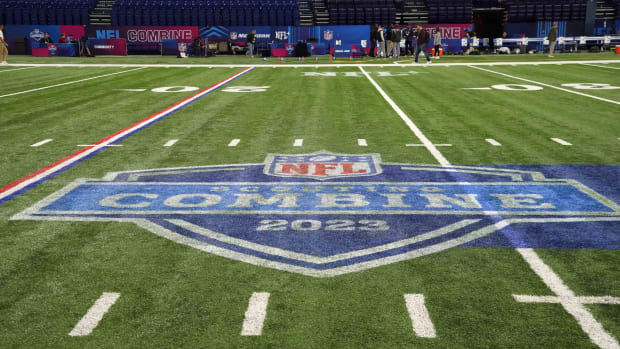 The 2023 NFL Scouting Combine logo on the field at Lucas Oil Stadium.