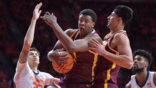 Minnesota forward Pharrel Payne (21) grabs a rebound during the first half against Illinois at State Farm Center in Champaign, Ill., on Feb. 28, 2024.