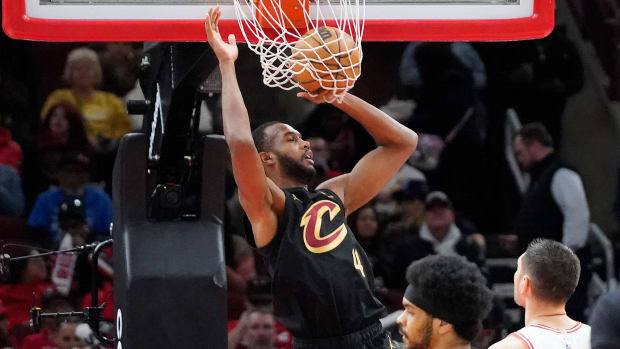 Feb 28, 2024; Chicago, Illinois, USA; Cleveland Cavaliers forward Evan Mobley (4) scores against the Chicago Bulls during the first quarter at United Center.