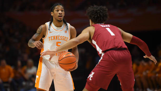 Tennessee guard Zakai Zeigler (5) dribbles down the court with Alabama guard Mark Sears (1) defending during the NCAA game at Thompson-Boling Arena at Food City Center, Saturday, Jan. 20, 2024.  