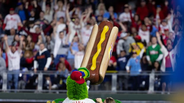May 3, 2022; Philadelphia, Pennsylvania, USA; The Phillie Phanatic fires hot dogs into the stands between innings of a game between the Philadelphia Phillies and the Texas Rangers at Citizens Bank Park. Mandatory Credit: Bill Streicher-USA TODAY Sports