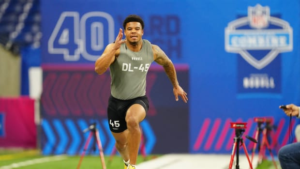 Penn State defensive end Chop Robinson runs the 40-yard dash at the 2024 NFL Scouting Combine.