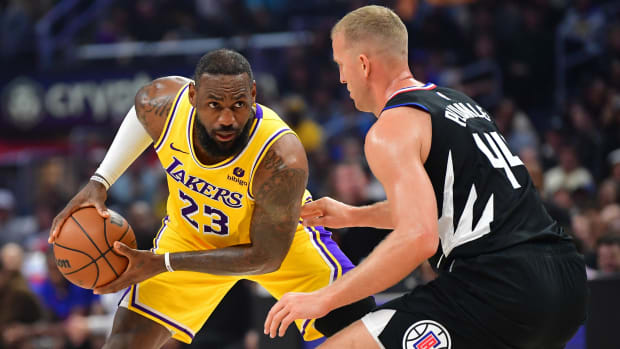 LeBron James sizes up Mason Plumlee during a game against the Clippers