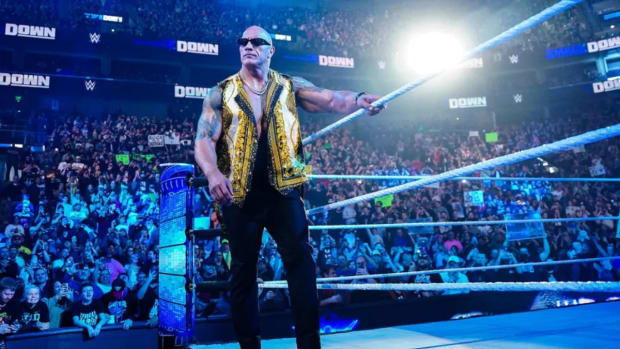The Rock gets ready to enter the WWE SmackDown ring to become a member of The Bloodline.