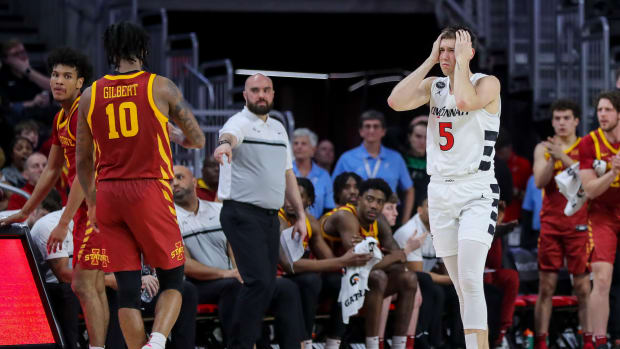 Feb 13, 2024; Cincinnati, Ohio, USA; Cincinnati Bearcats guard CJ Fredrick (5) reacts after a foul called in the second half in the game against the Iowa State Cyclones at Fifth Third Arena. Mandatory Credit: Katie Stratman-USA TODAY Sports