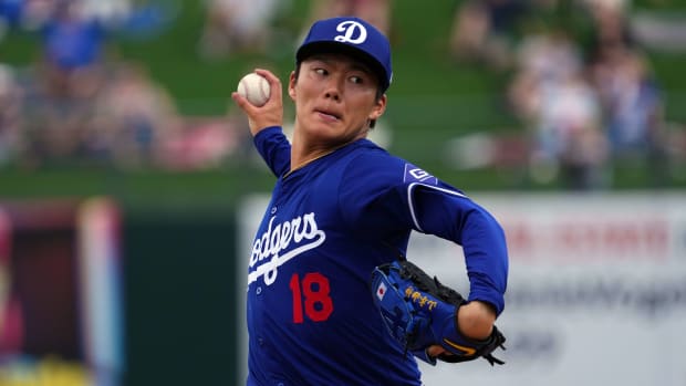 Los Angeles Dodgers starting pitcher Yoshinobu Yamamoto threw two scoreless innings in his Cactus League debut against the Texas Rangers on Wednesday at Surprise Stadium.