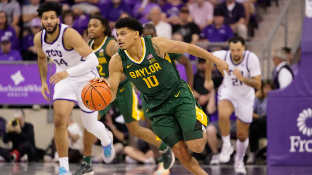 Feb 26, 2024; Fort Worth, Texas, USA; Baylor Bears guard RayJ Dennis (10) dribbles against the TCU Horned Frogs during the second half at Ed and Rae Schollmaier Arena.