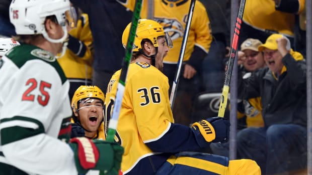 Feb 29, 2024; Nashville, Tennessee, USA; Nashville Predators left wing Cole Smith (36) celebrates after a goal during the first period against the Minnesota Wild at Bridgestone Arena.