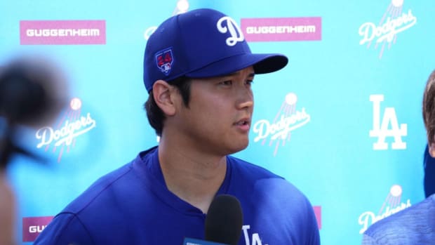 Los Angeles Dodgers designated hitter Shohei Ohtani speaks to media during a workout at Camelback Ranch.