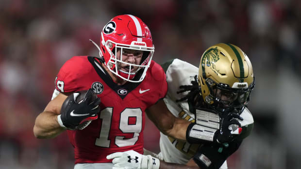 Sep 23, 2023; Athens, Georgia, USA; Georgia Bulldogs tight end Brock Bowers (19) scores on a 41-yard touchdown reception against against UAB Blazers linebacker Nikia Eason (10) in the first half at Sanford Stadium. Mandatory Credit: Kirby Lee-USA TODAY Sports