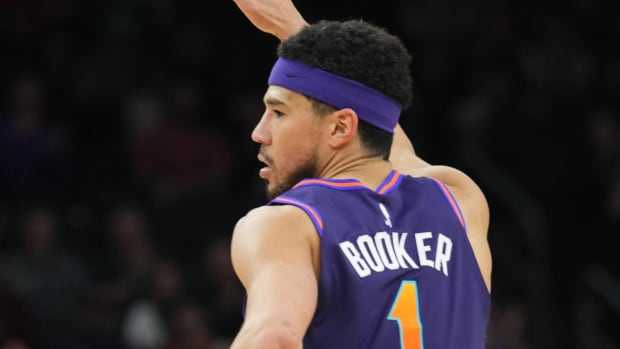 Phoenix Suns guard Devin Booker (1) reacts against the Houston Rockets during the second half at Footprint Center.