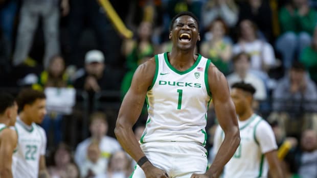 Oregon center N'Faly Dante celebrates during the first half as the Oregon Ducks host the Oregon State Beavers Wednesday, Feb. 28, 2024 at Matthew Knight Arena in Eugene, Ore.