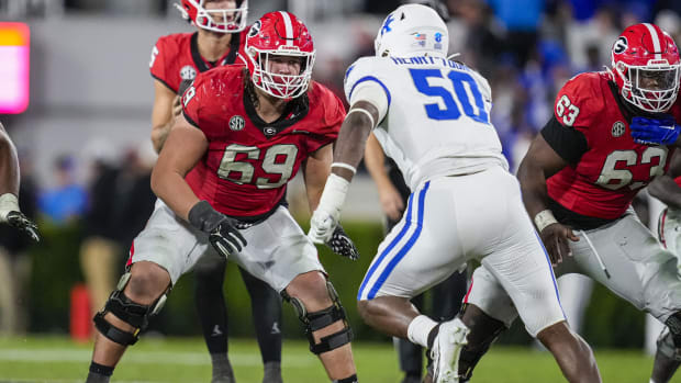 Oct 7, 2023; Athens, Georgia, USA; Georgia Bulldogs offensive lineman Tate Ratledge (69) blocks against Kentucky Wildcats defensive lineman Darrion Henry-Young (50) during the second half at Sanford Stadium. 