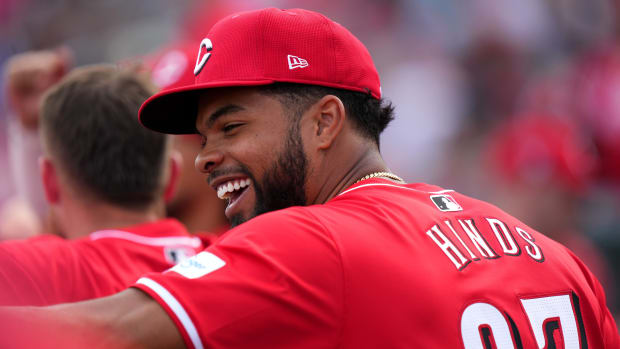 Cincinnati Reds right fielder Rece Hinds (87) smiles in the dugout in the sixth inning during a MLB spring training baseball game, Saturday, Feb. 24, 2024, at Goodyear Ballpark in Goodyear, Ariz.  