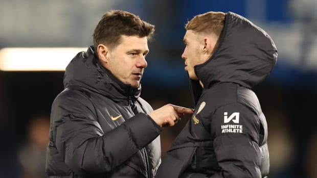 Chelsea manager Mauricio Pochettino pictured (left) speaking to Cole Palmer following a 4-0 win over Preston North End in January 2024