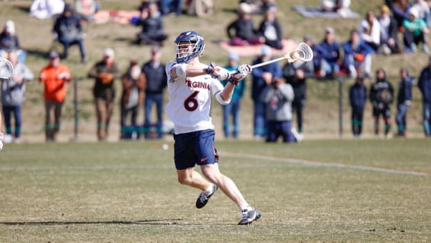 Will Inderlied shoots and scores during the Virginia men's lacrosse game against Ohio State at Klockner Stadium.