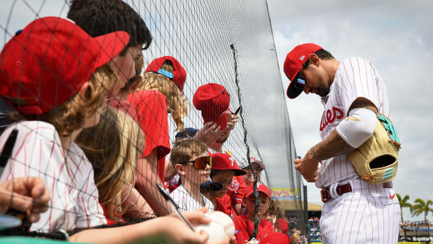 Mar 1, 2024; Clearwater, Florida, USA; Philadelphia Phillies right fielder Nick Castellanos (8) signs autographs before the start of the spring training game against the Miami Marlins at BayCare Ballpark.
