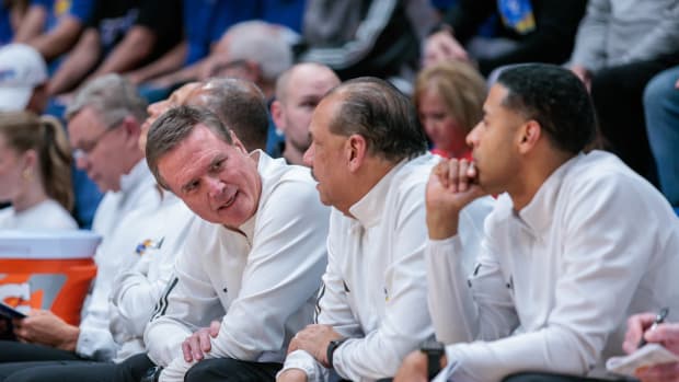 Feb 10, 2024; Lawrence, Kansas, USA; Kansas Jayhawks coach Bill Self speaks to the coaching staff on the bench during the second half against the Baylor Bears at Allen Fieldhouse.