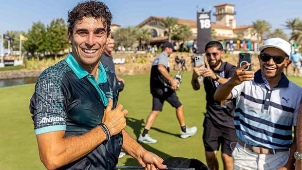 Joaquin Niemann of Chile smiles on the 18th green after winning the 2024 LIV Golf Jeddah tournament.